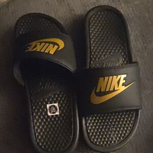 Nike Black Slides with Metallic Gold Logo